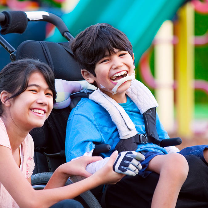 ChildwithCPwithsister in WHEELCHAIR